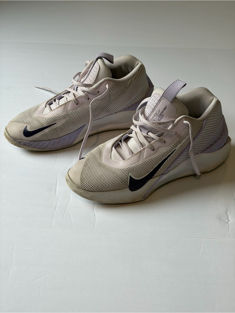 Nike Women’s Beige and Lavender Low-Top Basketball Sneakers with Black Swoosh